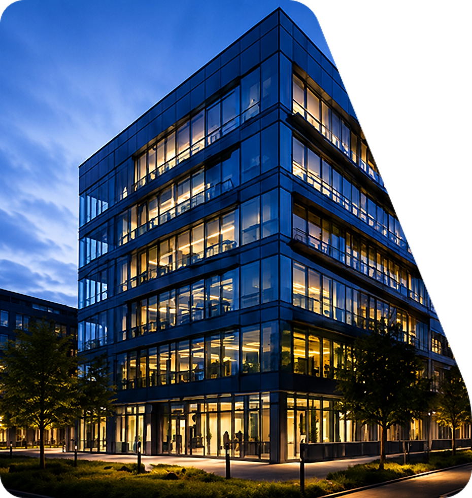 BGM Enterprises headquarters, a modern glass office building at dusk